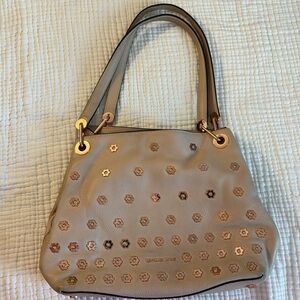 Michael Kors Soft Pink with Rose Gold Hardware & flower studs. Rare find used